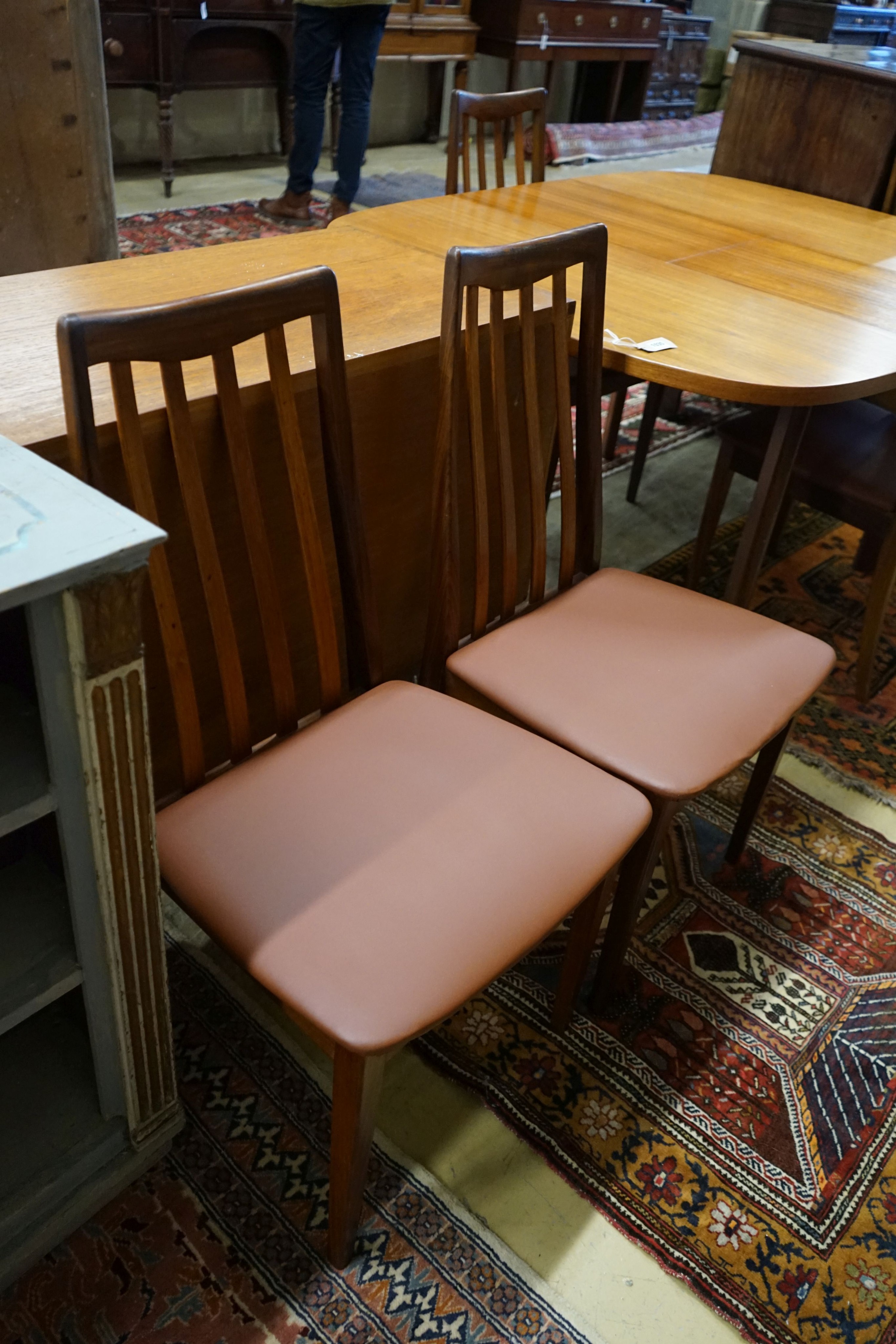 A G Plan teak dining suite comprising extending table, 158cm extended, width 112cm, height 72cm, four chairs and a sideboard